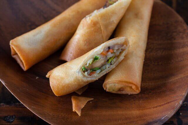 Vegetable Egg Rolls on a wooden plate