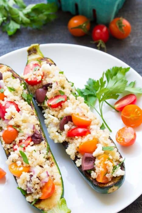 Grilled quinoa zucchini boats on a plate